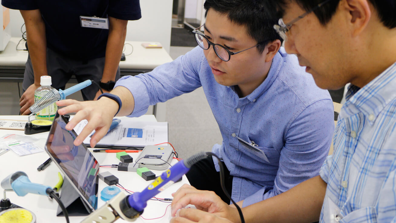 Attendees working on projects at the workshop.