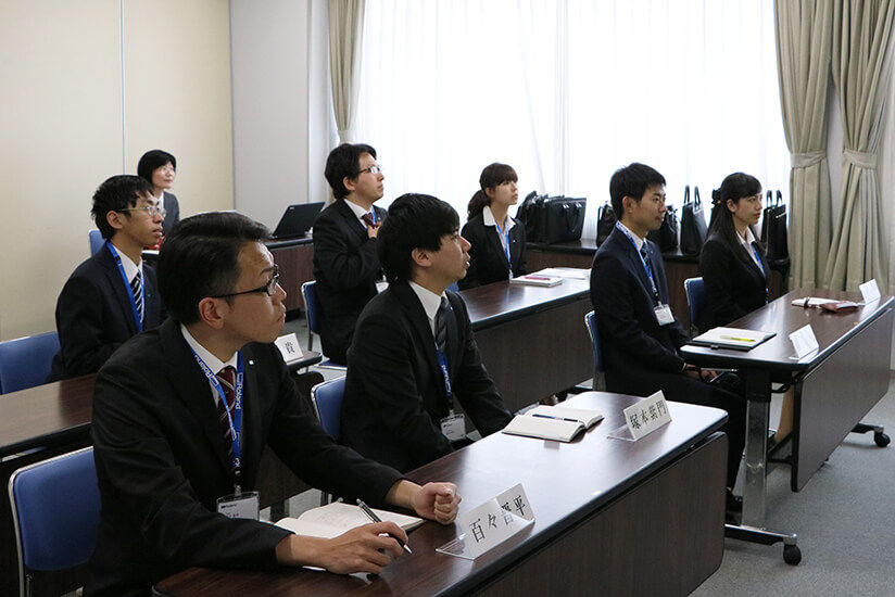The new employees attending the company orientation.