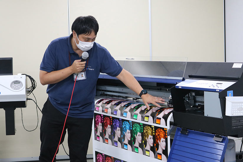 Staff demonstrating with an inkjet printer.