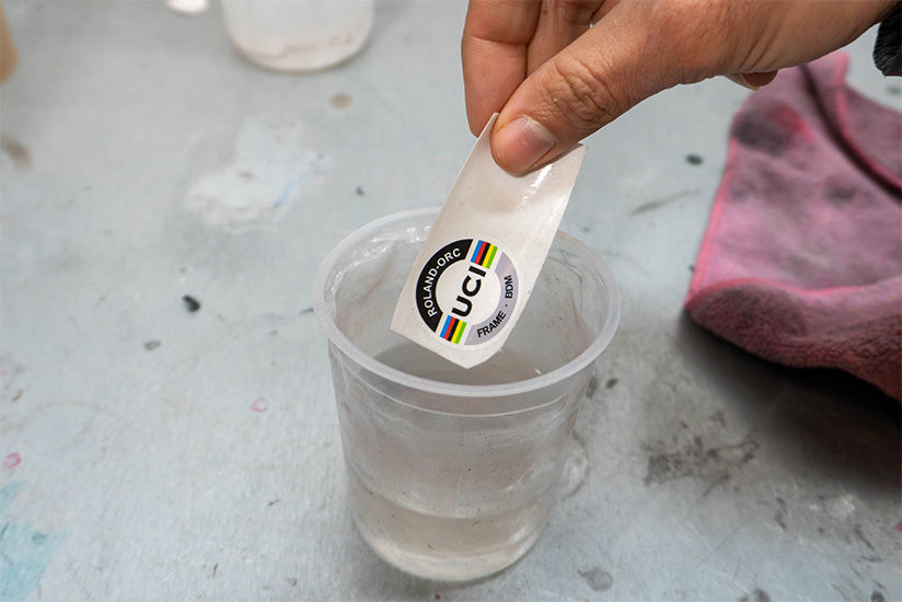 Printed & cut water-slide decals are first soaked in water.