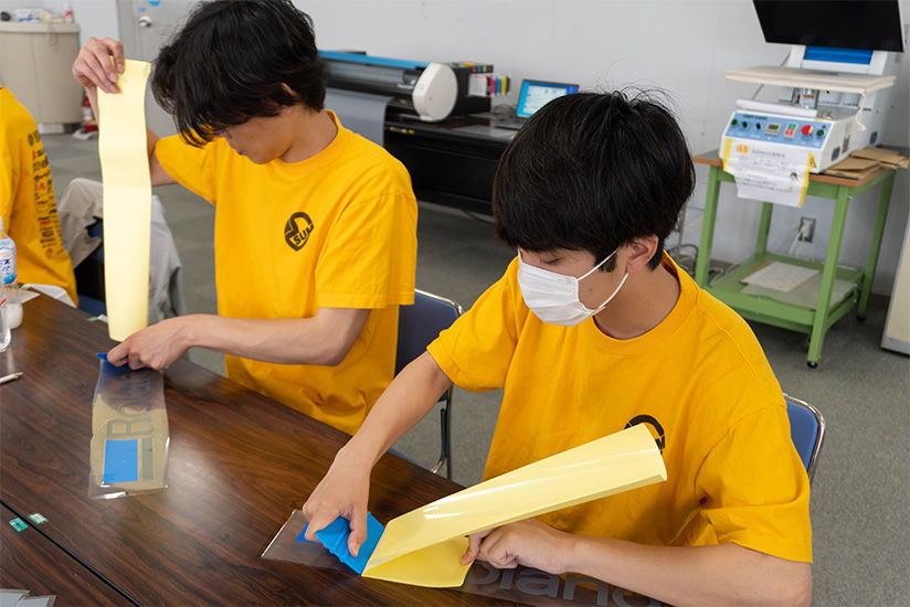 Members attempting the transfer sheet application process.
