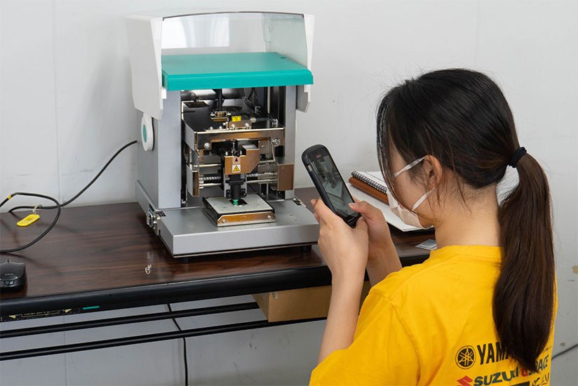 Experience of imprinting keychains with a photo impact printer.