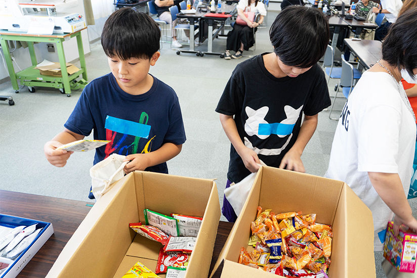 Selecting sweets to fill their bags.