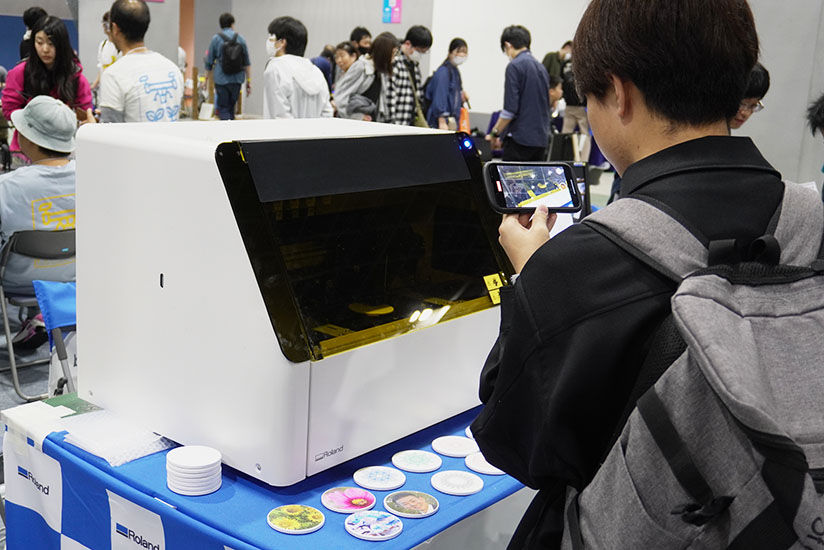 Visitors observing the printing process