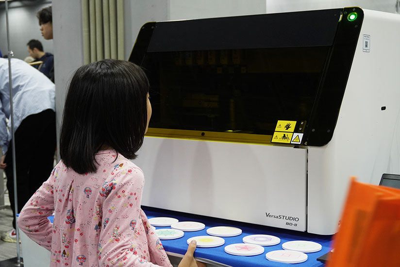 Children observing the printing process