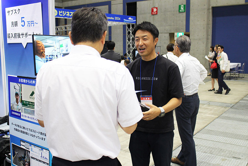 Staff explaining benefits to visitors