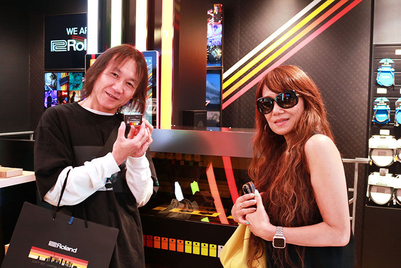 Customer posing with keychain and BD-8