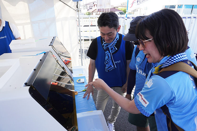 Supporters enjoying watching the printing process