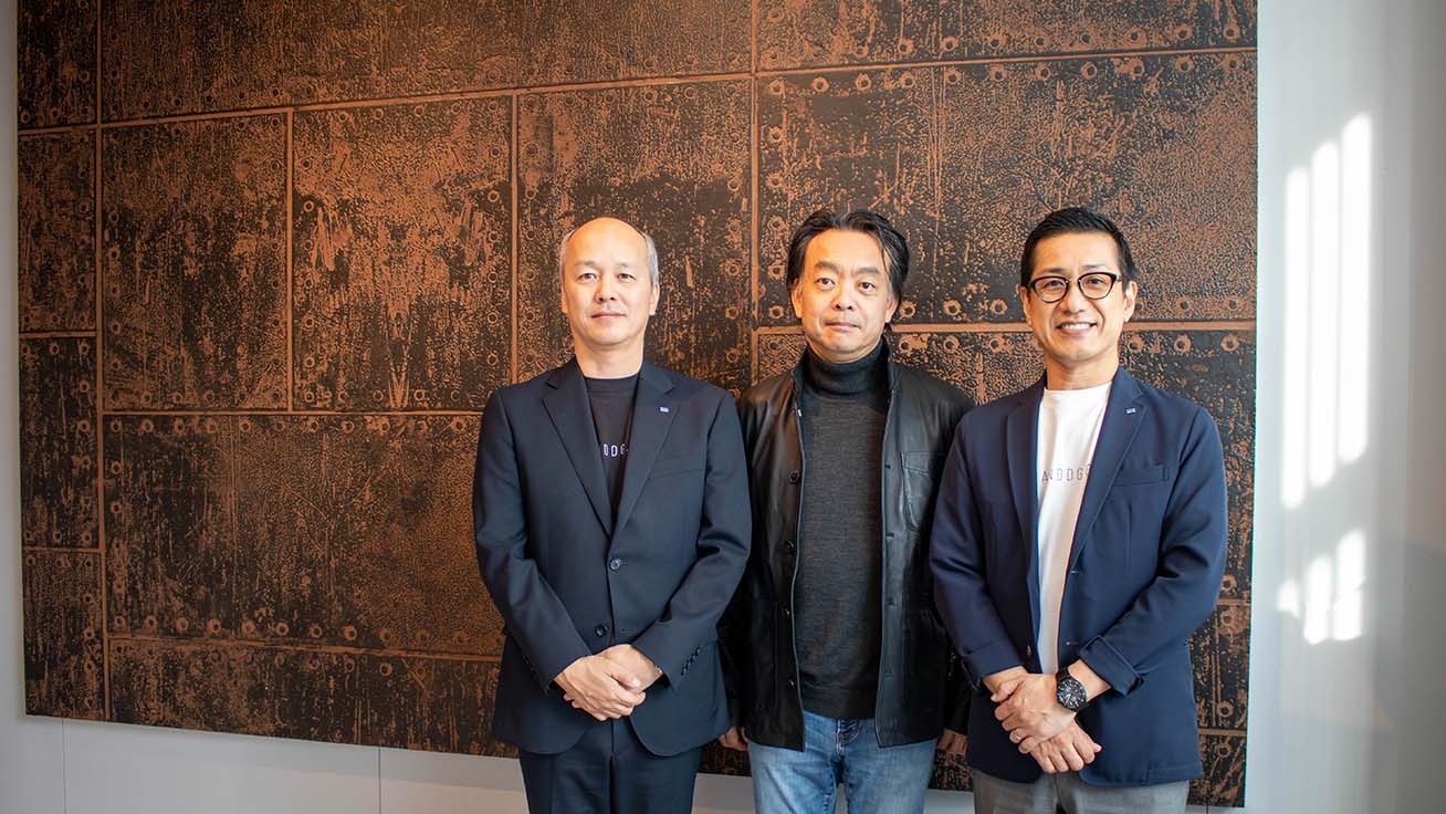 Commemorative photo in front of a DIMENSE artwork