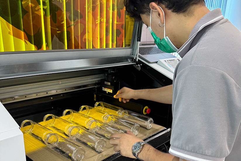 UV printing process on bottles using the MO-240