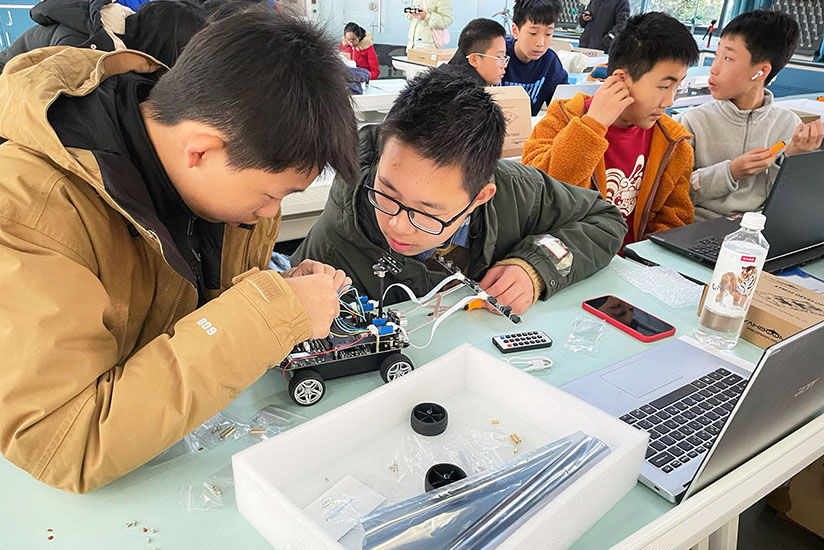 Students assembling their AI smart cars