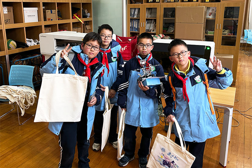 Students smiling with their customized creations