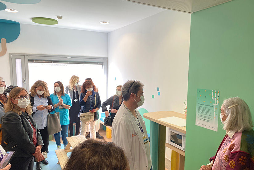 Hospital staff and partners viewing the completed installation
