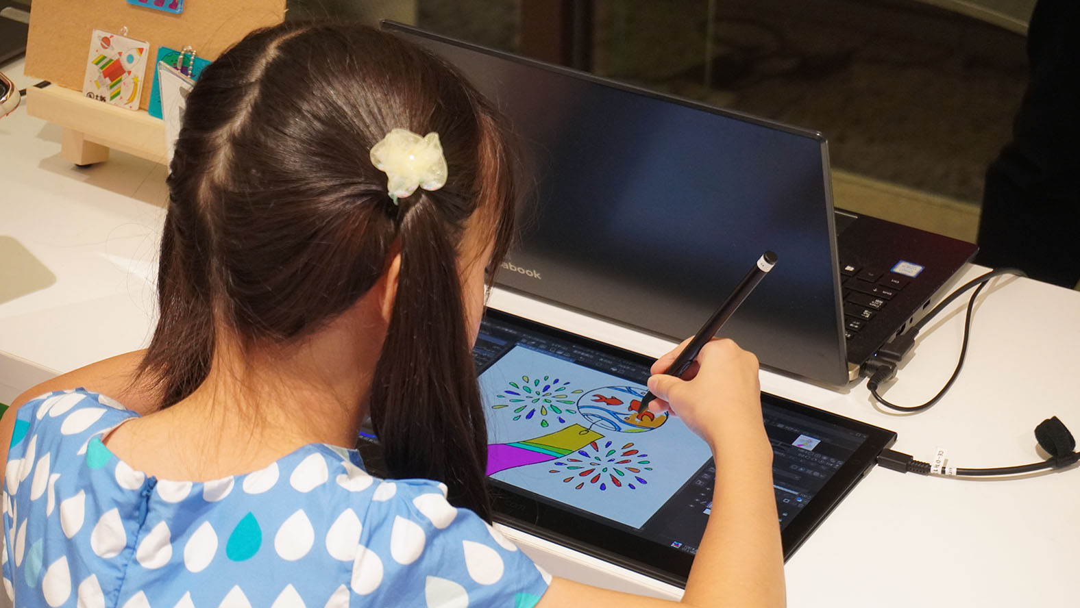 Participants painting in a coloring book
