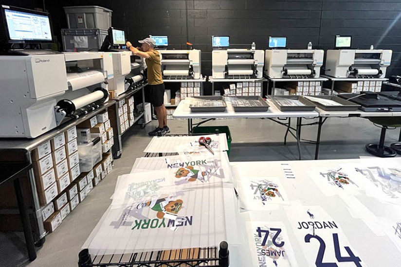 Personalized apparel printed on-site by six BY-20 direct-to-film printers