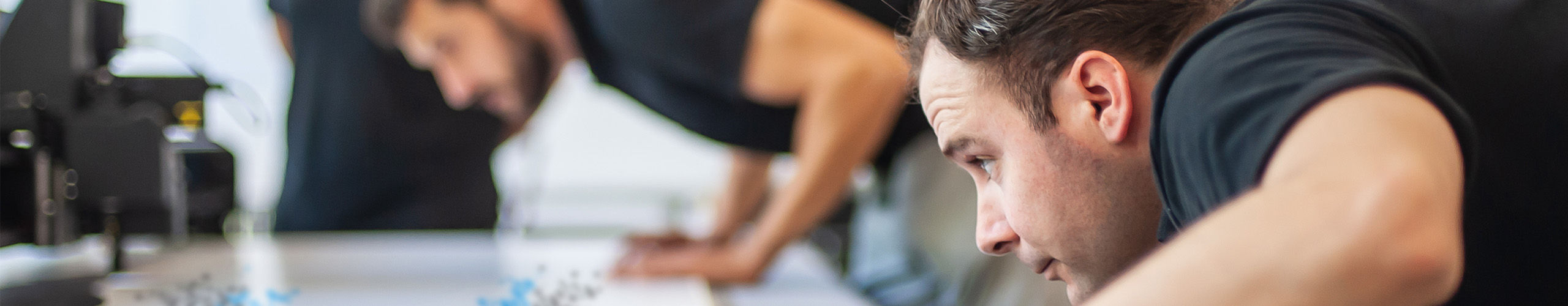 A person inspecting some print