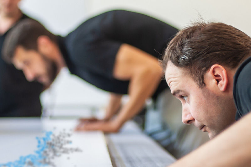 A person inspecting some print