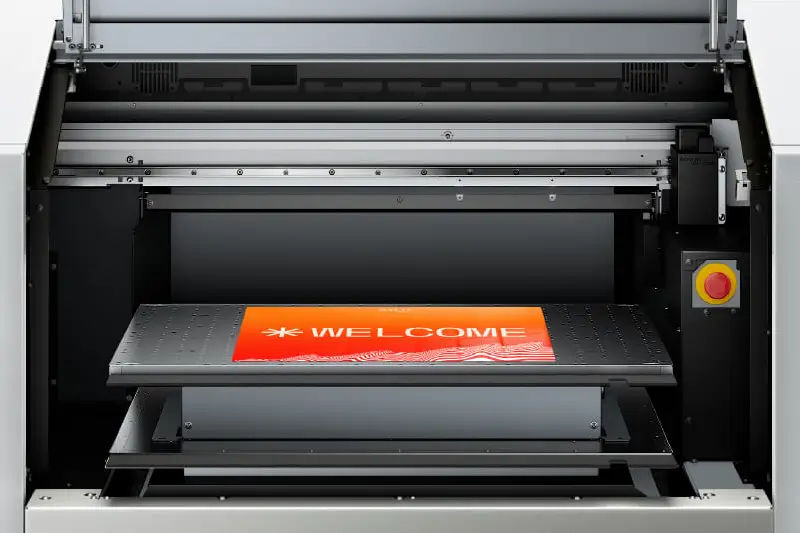 Roland DG TY-300 DTF printer with printed media.